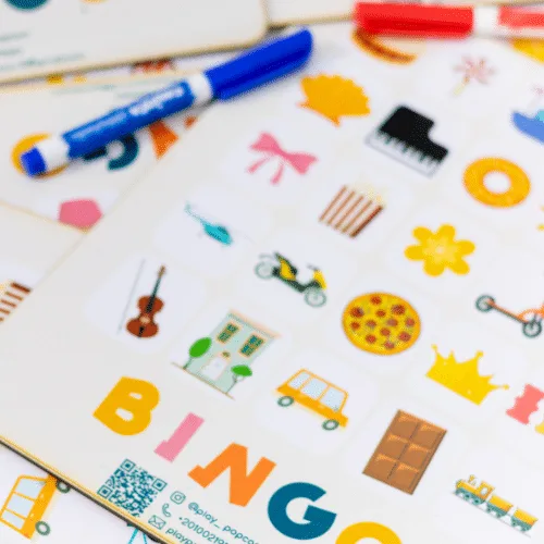 Close-up of a Bingo card and a marker ready to cross off shapes