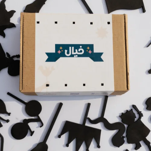 Khayal box surrounded by black shadow-puppet shapes