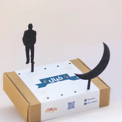 Khayal person and crescent moon shapes standing in the box lid